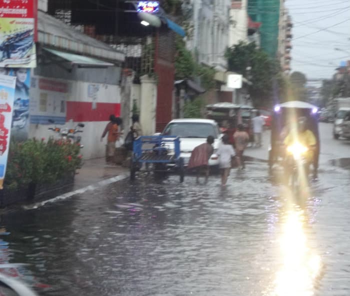 Flooded street and infrastructure investing in Cambodia