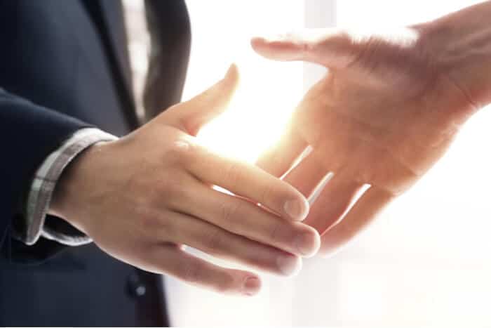 Business people shake hands