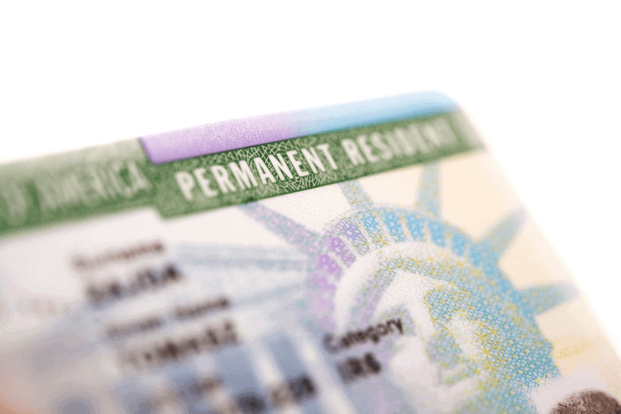 Permanent residence card placed in passport